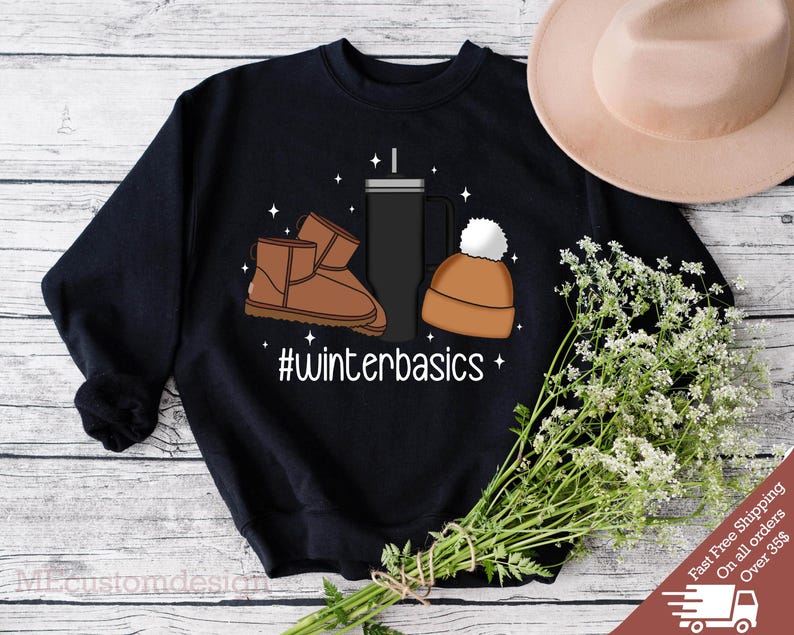 May include: Black sweatshirt with a graphic design of a brown winter boot, a brown beanie, and a black travel mug. The text "#winterbasics" is printed below the graphic.