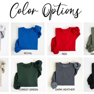 May include: Color options for a sweatshirt in ten different colors: Sport Gray, Royal, Red, Military Green, Sand, Forest Green, Dark Heather, Black, Navy, and White.