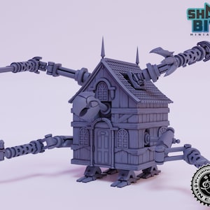 Puede incluir: Una miniatura impresa en 3D en gris de una casa con cuatro brazos mecánicos. La casa tiene una puerta, ventanas y un techo. Los brazos son articulados y tienen diferentes armas unidas a ellos. La miniatura está impresa en resina gris y tiene un acabado detallado. La miniatura está hecha por Shark Bite Miniatures.