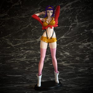 May include: A standing anime-style figurine of a character with purple hair and a yellow headband. The figure wears a cropped red jacket, a yellow top tied at the front, yellow shorts with black straps, pink thigh-high stockings, and white boots.
