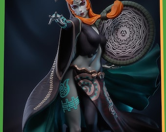 May include: A green and black action figure of a female character with orange hair, wearing a black hooded robe and holding a shield with a green and silver design. The figure has a green face with blue markings and a green and brown patterned skirt.