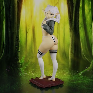 May include: A standing anime-style elf figurine with pale skin and long white hair tied in twin tails. The figure wears a cropped dark gray hoodie, a white and black striped thong, and matching white thigh-high socks with black stripes, positioned on a maroon cushion.