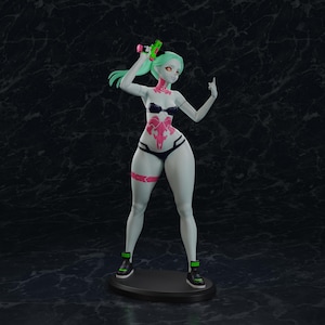 May include: A standing figurine of a pale-skinned character with mint green hair, wearing a black bikini set and black sneakers with green accents. The figure features pink tattoos on the torso and thigh, and holds a small green and pink toy pistol.