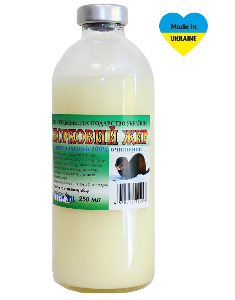 May include: A clear glass bottle with a white label that reads "ПП &laquo;СІЛЬСЬКЕ ГОСПОДАРСТВО УКРАЇНИ&raquo; НОРКОВИЙ ЖИР натуральний 100% очищений" and "Made in UKRAINE" in a yellow and blue heart. The bottle contains a white liquid and is labeled with a barcode and "250 мл".