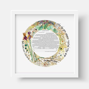 May include: A watercolor ketubah, a Jewish marriage contract, with a circular design featuring a floral motif and Hebrew text. The text reads "Blessed are you, Lord our God, King of the Universe, who has sanctified us with His commandments and commanded us to be sanctified by entering into the covenant of marriage."