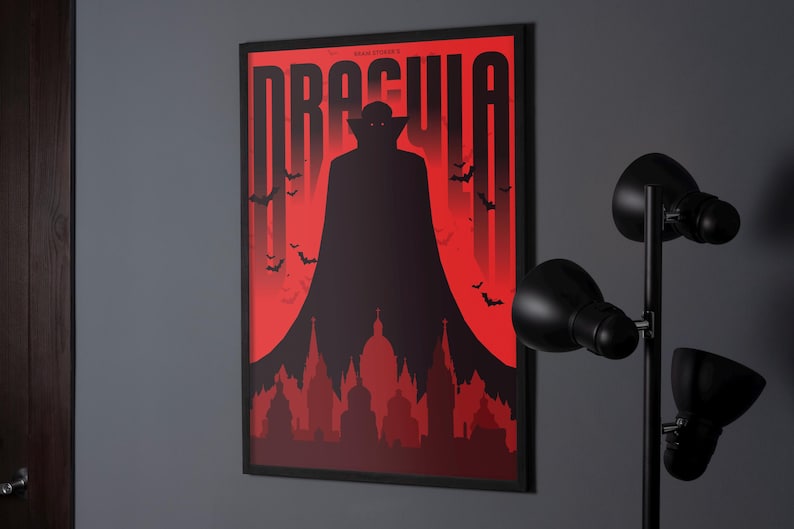 May include: A black and red poster with the title "Dracula" in bold white letters. A silhouette of a vampire with a cape stands in front of a red background with bats flying around. The vampire is standing in front of a city skyline.