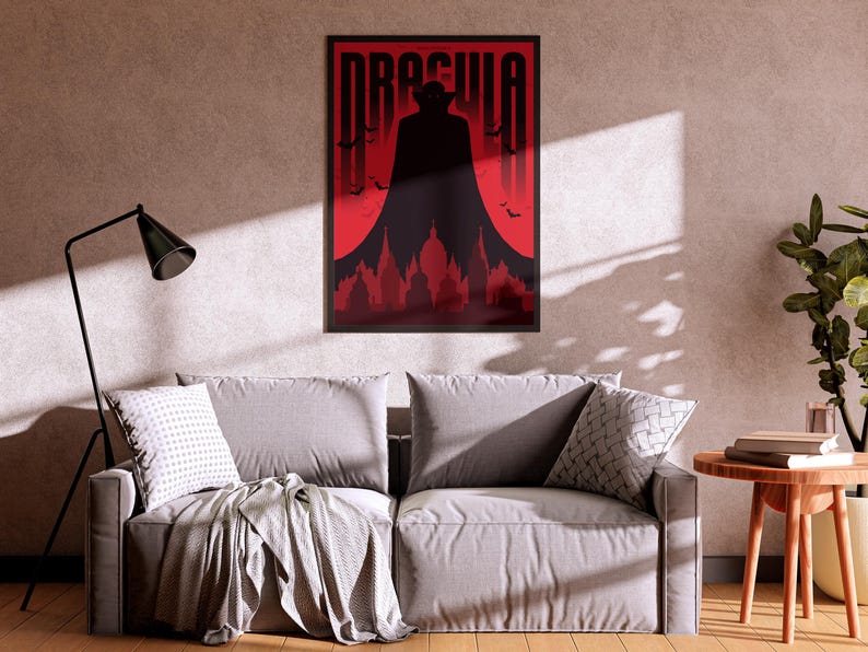 May include: A black and red poster with the word "Dracula" in white letters. The poster features a silhouette of a man in a cape standing in front of a red moon and a cityscape.
