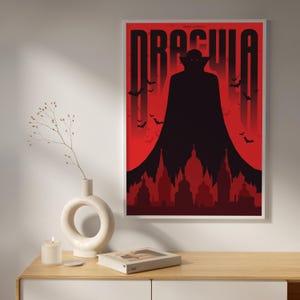 May include: A red and black poster with the title "Dracula" in bold white letters. The poster features a silhouette of Dracula standing in front of a red moon and a cityscape.