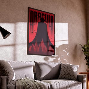 May include: A black and red poster with the word "Dracula" in white letters. The poster features a silhouette of a person in a cape standing in front of a red background with bats flying around them.