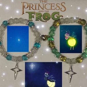 May include: Two bracelets with charms. One bracelet is white and blue with a star charm. The other bracelet is green and yellow with a firefly charm. The bracelets are inspired by the Disney movie "The Princess and the Frog".