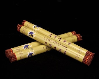 May include: Three bundles of incense sticks wrapped in yellow paper with blue and gold designs. The paper is printed with Tibetan text and the words "Chubu Temple Incense".