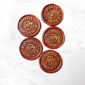 May include: Five red wax seals with gold lettering and a Santa Claus image. The seals read "North Pole Official Seal".