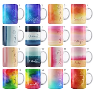 May include: Set of 16 watercolor-style mugs with various colour gradients and names written on each mug. The mugs are white with a white handle.