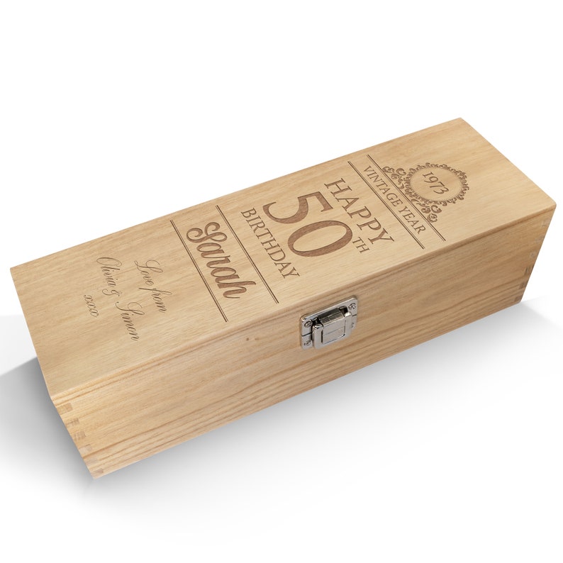 May include: Wooden wine box with a personalized message for a 50th birthday. The box is engraved with "Happy 50th Birthday Sarah, Vintage Year 1973, Love from Olivia & Saman 2023".