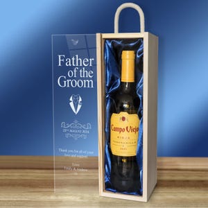 May include: A wooden box with a clear acrylic panel on the front. The box contains a bottle of Campo Viejo Rioja Tempranillo wine. The acrylic panel has the text "Father of the Groom" with a tuxedo graphic and the date "22nd August 2024". The text "Thank you for all of your love and support" and "Love Emily & Andrew" is also on the panel.