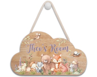 May include: Wooden cloud-shaped door sign with a rope hanger. The sign features a woodland theme with a variety of animals including a bear, fox, owl, rabbit, squirrel, and hedgehog. The sign is personalized with the name "Theo's Room" in purple text.