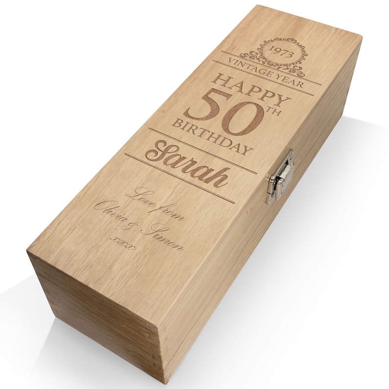 May include: A wooden wine box with an engraved message that reads "Vintage Year 1972 Happy 50th Birthday Sarah Love from Alvin & Simon 2022".