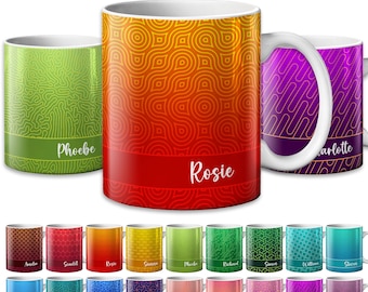 May include: A collection of personalized ceramic mugs with various colorful patterns and names. The mugs feature designs in shades of green, orange, red, and purple. Each mug has a white handle and a name printed on a band.