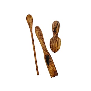 May include: A set of three wooden kitchen utensils made from olive wood. The utensils include a spoon, a small scoop, and a fork.