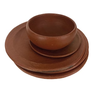 May include: A set of three terracotta plates and a bowl. The plates are stacked on top of each other, with the bowl sitting on top of the plates.