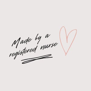 May include: Black and white handwritten text that reads "Made by a registered nurse" with a pink heart drawn to the right of the text.