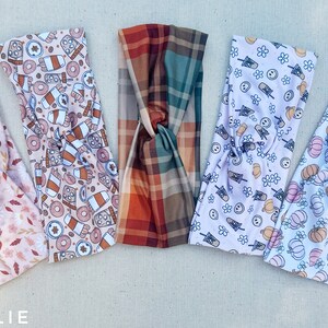 May include: Five different patterned headbands in a variety of autumn-themed prints. The headbands are made of a soft, stretchy fabric and are perfect for adding a touch of style to any outfit.