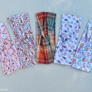 May include: Five different patterned headbands in a variety of autumnal colours and designs. The headbands are made of a soft, stretchy fabric and are perfect for adding a touch of style to any outfit.
