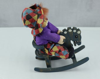 Vintage porcelain clown, porcelain clown on his rocking horse, rocking horse, decoration toy, vintage clown, horse trinket