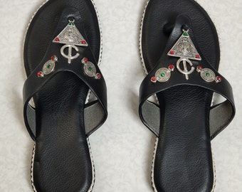 Handcrafted Berber leather shoes for women, handmade black Moroccan flip-flops decorated with silver Tuareg Berber fibulae