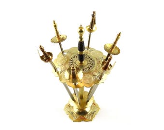 Vintage gold-plated Toledo cocktail swords, six appetizer swords with stand, enameled appetizer picks, rare metal Toledo cocktail picks from 1960