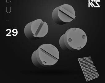 May include: A 3D rendering of four gray detail covers with various slot and hole designs. The covers are cylindrical with flat tops and bottoms. The image includes the text "Detail Cover" and "29". A small rectangular grid of small gray cylinders is also present.
