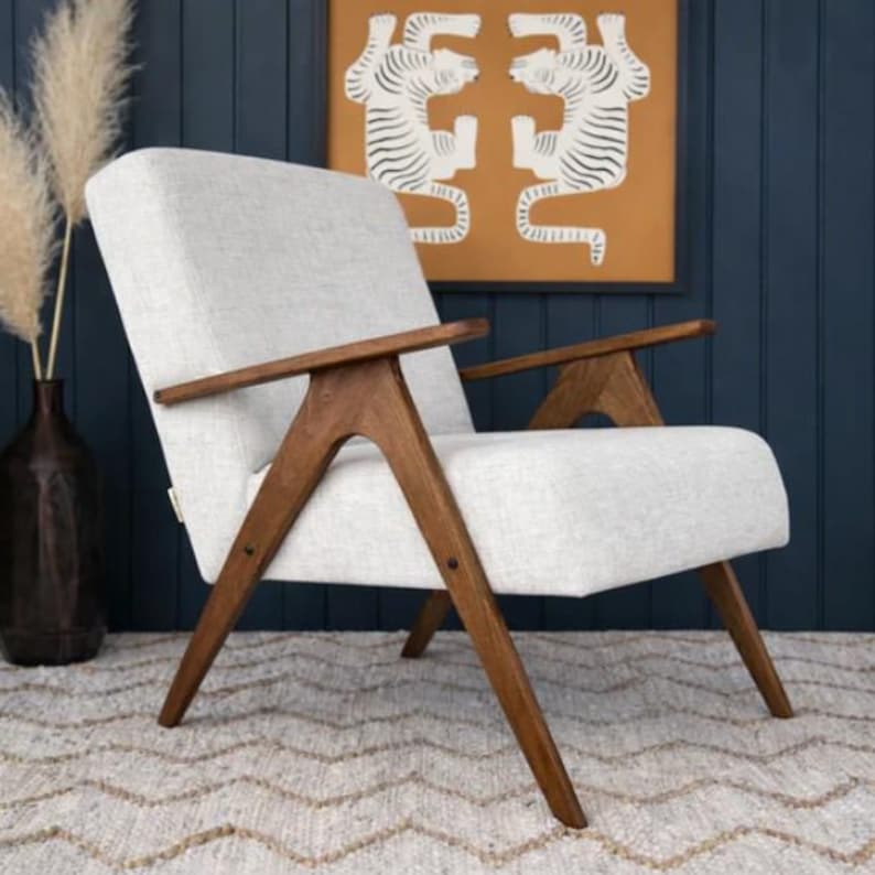 May include: A handmade wooden sign with the text "Welcome to our home" in a handwritten style. The sign is rectangular, painted white with black lettering, and features a simple, rustic design. It is likely intended for indoor or outdoor home decor.