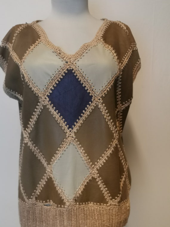 Leather sleeveless blouse