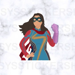 May include: A female superhero with brown hair and a blue and gold costume is holding a purple glowing object in her right hand. She is wearing a red cape and a blue mask.