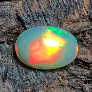 AAA+ Natural Ethiopian Welo Colorful Fire Opal Oval Shape Cabochon Loose Semi Precious Gemstone For Use Making Jewelry 2 cts 11x7.60x4.10 mm