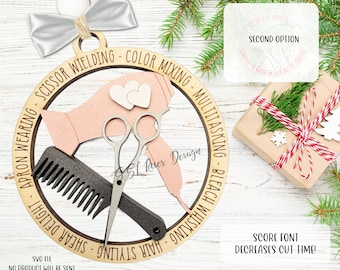 May include: A wooden ornament shaped like a circle with a hair dryer, scissors, and comb inside. The ornament has text around the outside that says "Hair Styling - Shear Delight - Apron Wearing - Scissor Wielding - Color Mixing - Multitasking - Bleach Whiskin".
