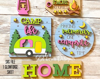 Könnte beinhalten: Ein Satz von vier Holzschilden mit Camping-Motiv. Die Schilder zeigen Sätze wie "Camp Life", "Making Smores Memories", "Making Memories One Campsite at a Time" und "Home is Where You Park It". Die Schilder sind in verschiedenen Farben bemalt, darunter Grün, Pink, Gelb und Blau.
