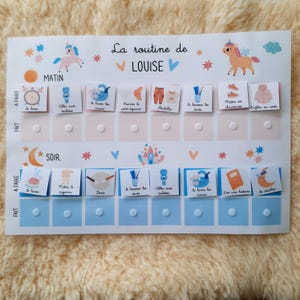 May include: A white and blue chart with the words "La routine de LOUISE" at the top. The chart is divided into two sections, "Matin" and "Soir", and lists various activities for a child to complete, such as "Se laver les mains", "S'habiller", and "Se coucher".