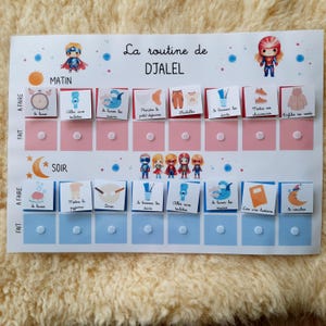 May include: A white chart with a blue and pink color scheme. The chart is divided into two sections, "Morning" and "Evening". Each section has a list of activities with corresponding images. The chart is titled "La routine de DJALEL".