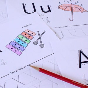 May include: A worksheet for learning the letter U. The worksheet includes a picture of a xylophone, an umbrella, and a practice area for tracing the letter U. The text "lets practice!" is written on the worksheet.