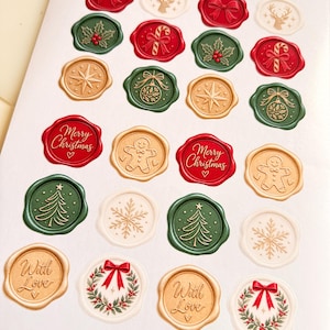 May include: A collection of circular wax seals in red, green, gold, and white, featuring embossed holiday designs including bows, holly, candy canes, stars, ornaments, gingerbread men, Merry Christmas text, trees, snowflakes, and wreaths.