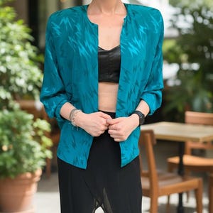Jaren 80 blazer zonder sluiting met geometrisch patroon maat medium groene vintage blouse