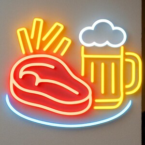 May include: A neon sign featuring a steak, fries, and a beer mug. The steak is red with a white outline, the fries are yellow, and the beer mug is yellow with a white cloud-shaped foam. A blue line curves beneath the food and drink.