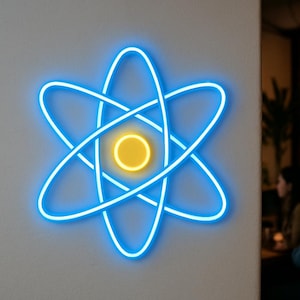 May include: A neon sign in the shape of an atom, with a blue outline and a yellow center, is mounted on a white wall. The sign is illuminated, creating a bright and modern aesthetic. The background is blurred, with a glimpse of a bar setting.