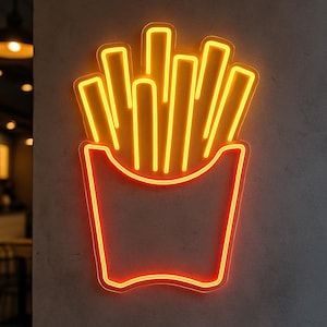 Op de afbeelding: Een neon-bord in de vorm van een doos friet. De friet is geel en de doos is oranje.