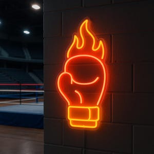 May include: A neon sign in the shape of a boxing glove with flames above it, mounted on a dark brick wall. The sign glows with a bright orange color. The background shows a boxing ring and arena seating.