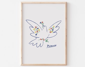 May include: A framed print of a blue line drawing of a white dove with colorful flowers. The dove is holding a flower in its beak. The artist's signature, "Picasso", is in blue ink below the dove.