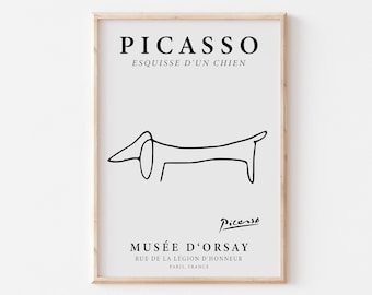 May include: Black and white line art print of a dog, titled "Picasso, Esquisse d'un Chien". The print includes the museum's name, "Musée d'Orsay", and address, "Rue de la Légion d'Honneur, Paris, France".