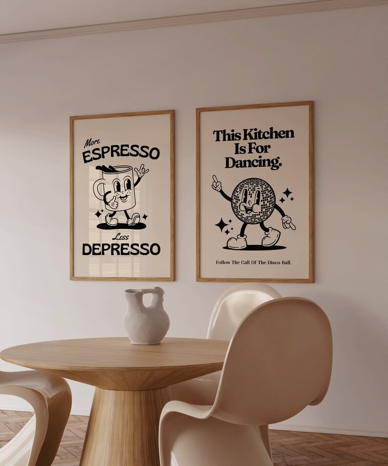 May include: Two framed art prints with a retro design. One says "More ESPRESSO Less DEPRESSO" with a cartoon coffee cup. The other says "This Kitchen Is For Dancing" with a disco ball character. Both are in wooden frames.