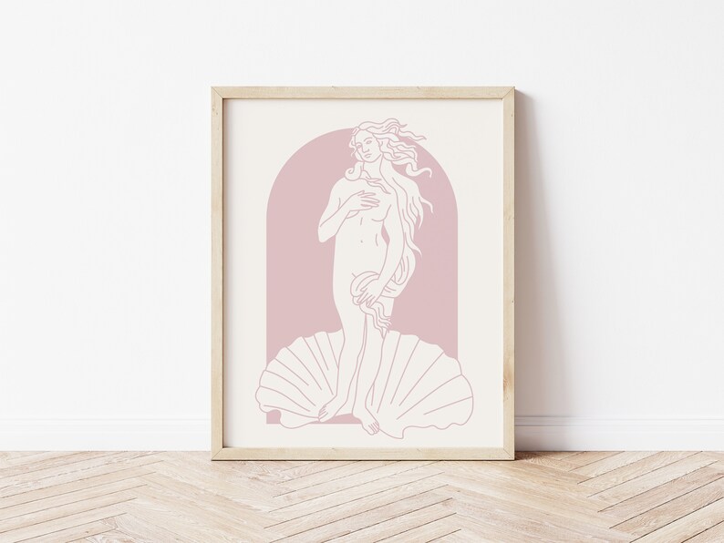 Peut inclure: Une impression encadr&eacute;e d'un dessin au trait de la Naissance de V&eacute;nus, un c&eacute;l&egrave;bre tableau de la Renaissance. La figure est repr&eacute;sent&eacute;e dans un sch&eacute;ma de couleurs rose et blanc.
